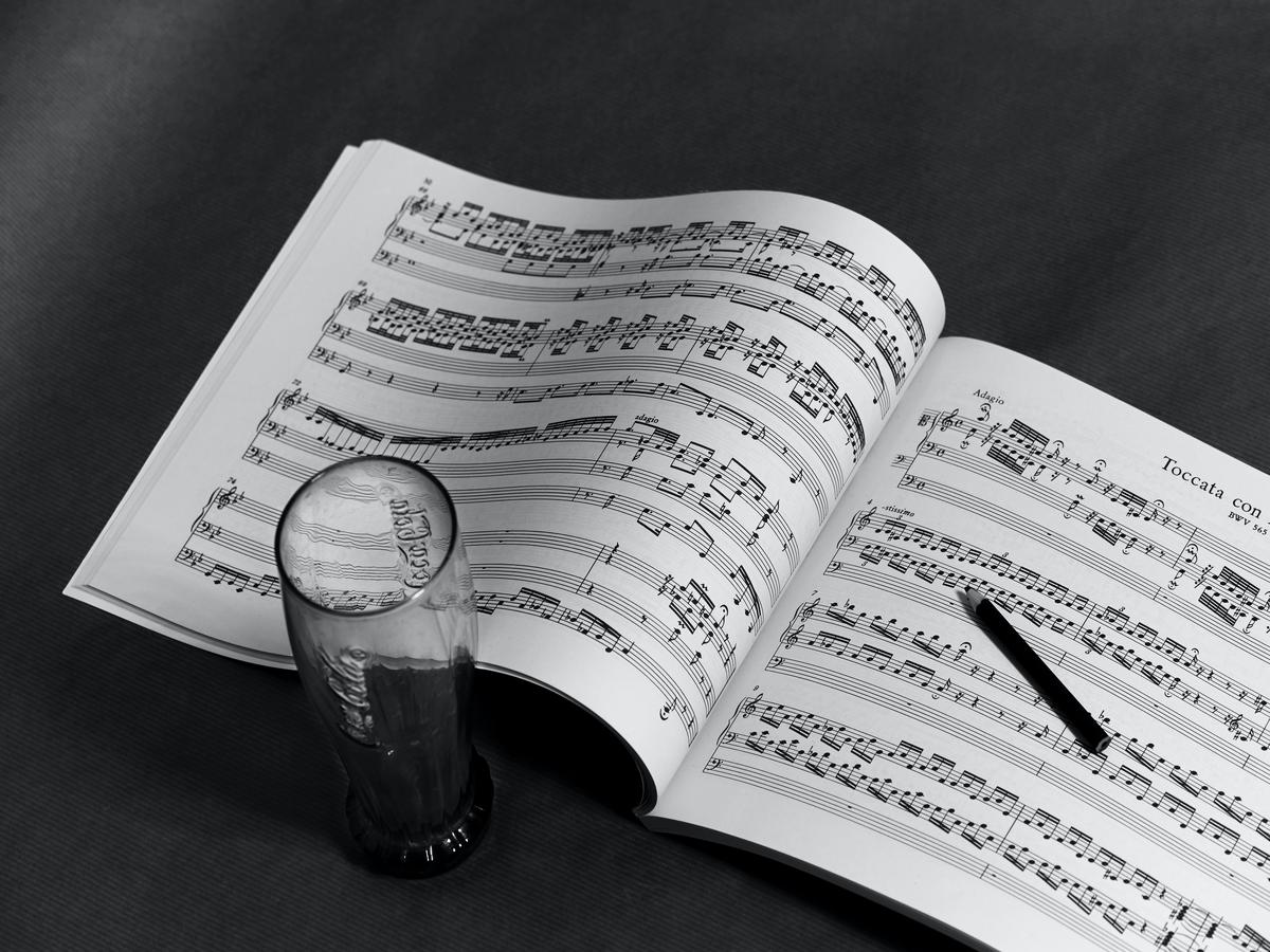 Image of musical notes and an instrument playing them.